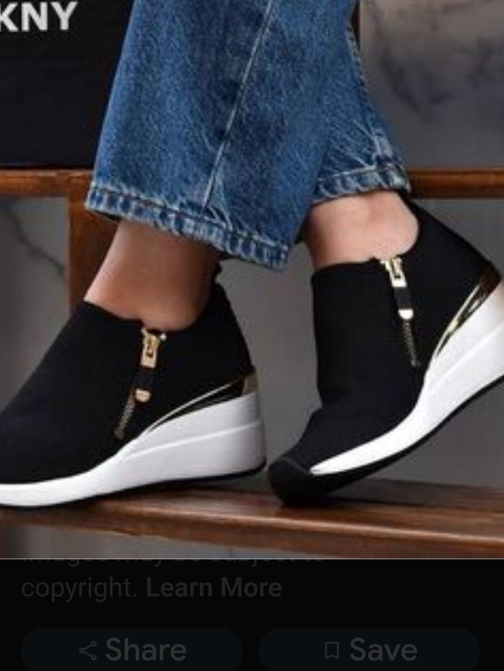 DKNY Black Wedge Slip-On Sneakers with Gold Accent
